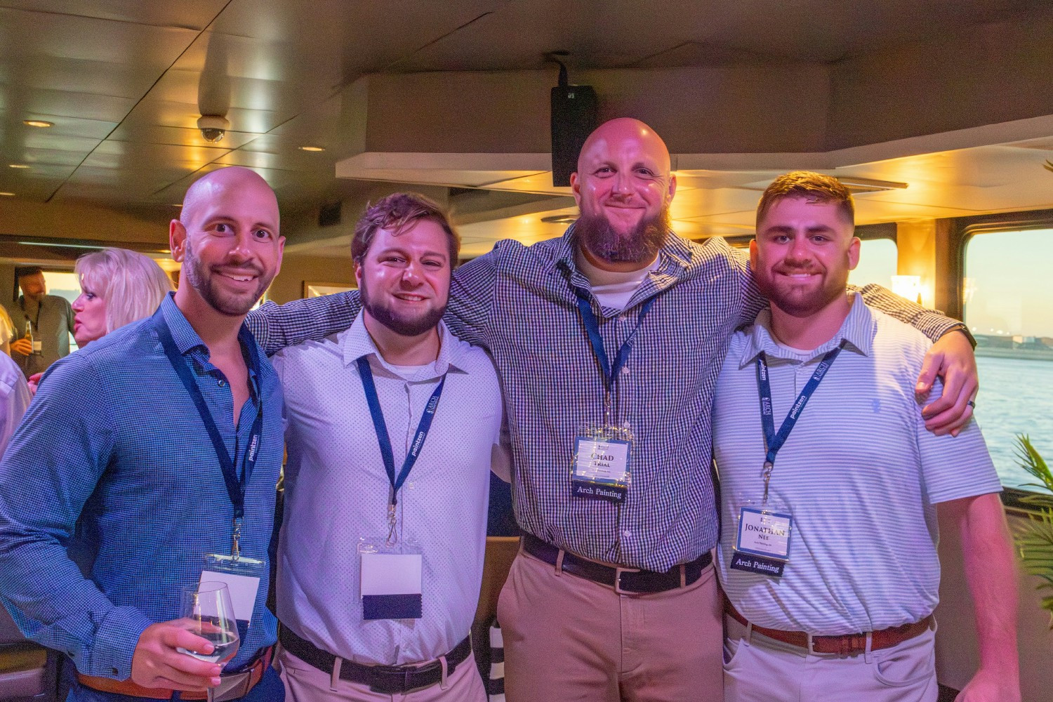 Arch Painting employees enjoying the annual customer event in September 2025 on a luxury cruise of Boston Harbor 