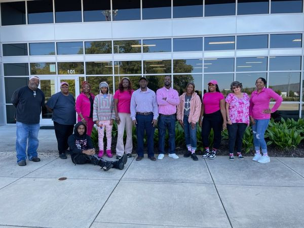 Our Olive Branch Warehouse colleagues wearing pink in support of Breast Cancer Awareness Month 