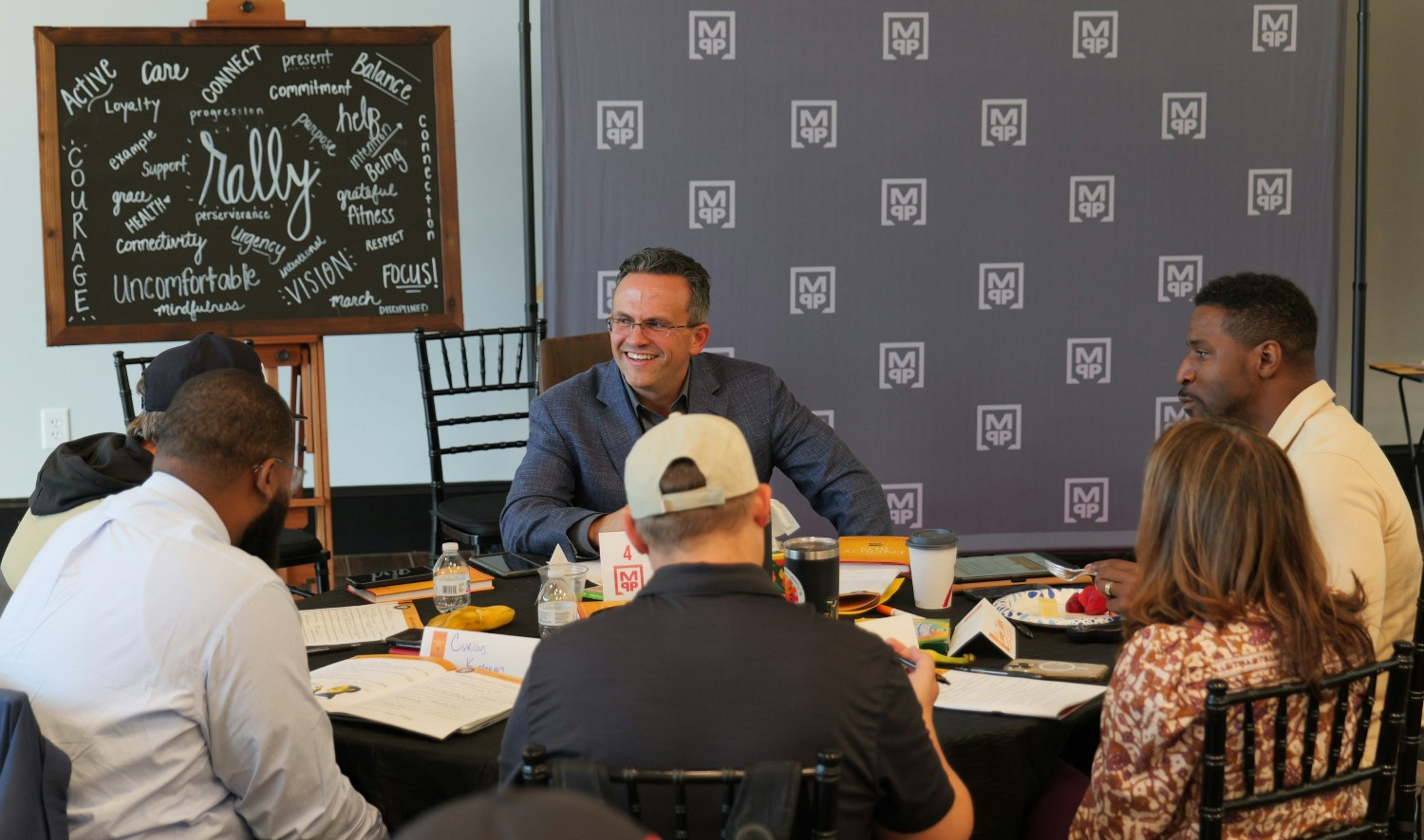 Our CEO, strategic partners, and team members during one of our company-wide development activities.