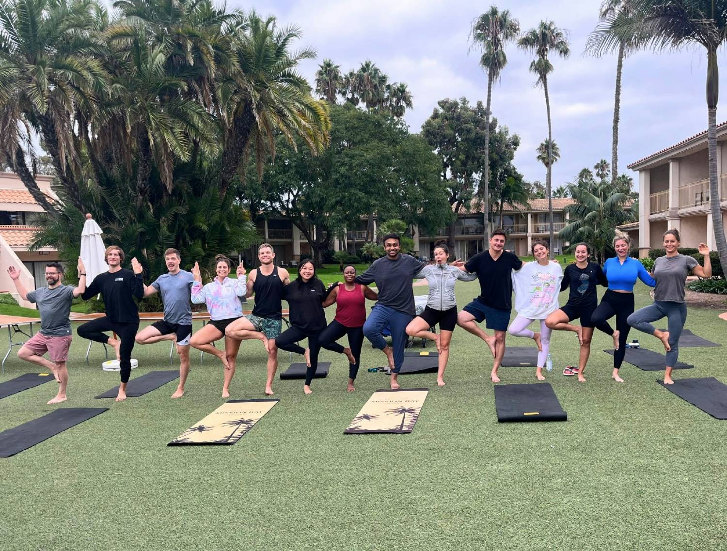 Teammates enjoying some morning yoga during our 2023 company offsite in sunny San Diego, CA!