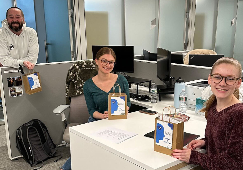 Fostering well-being during busy season: Our People Ops team shows care for colleagues by assembling wellness kits.