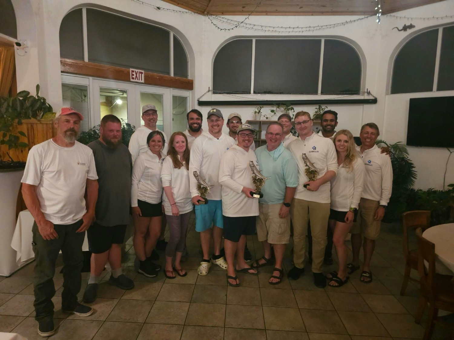 QSRSoft taking home a trophy in the Kids and Clay Tarpon tournament.