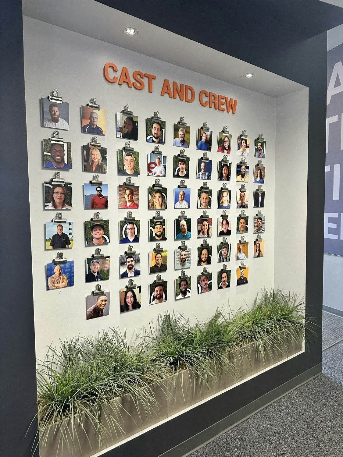 Our 'CAST AND CREW' wall that sits just behind our reception wall as you enter the building.
