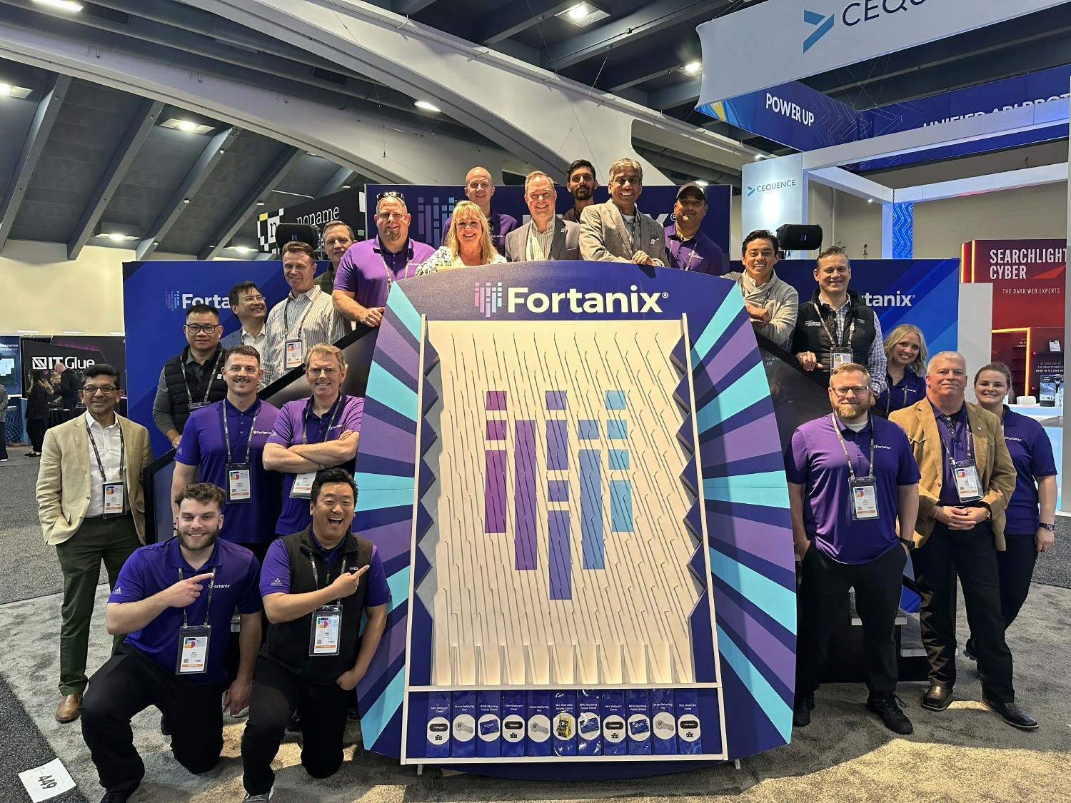 Our team gathered around our Fortanix Plinko Board at RSA23