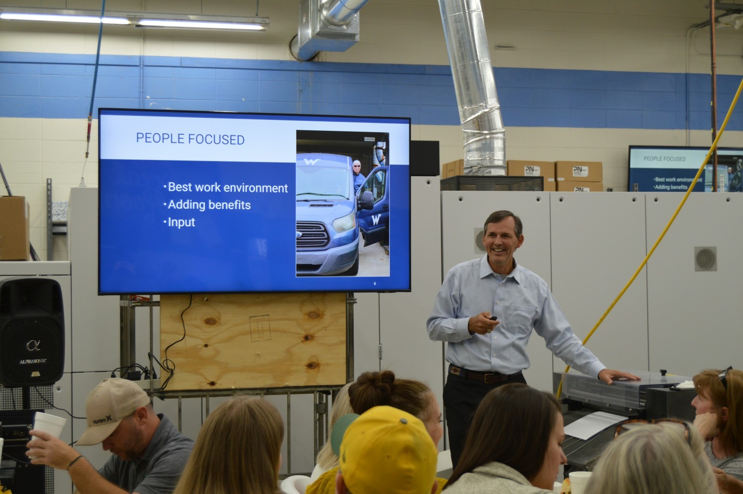 Our CEO, Taylor, leading a meeting at our annual Thanksgiving Potluck