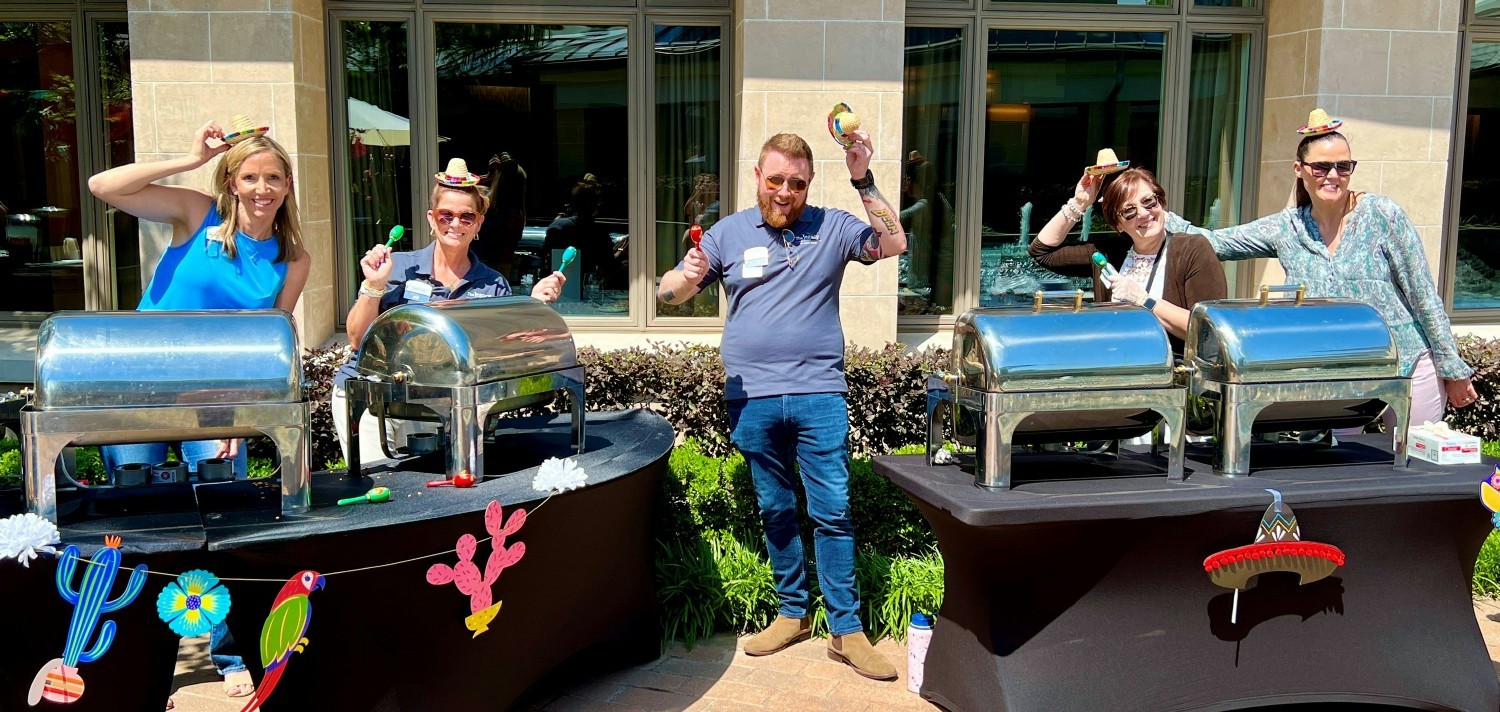 Legacy Directors getting ready to serve team members lunch for a Cinco De Mayo celebration.