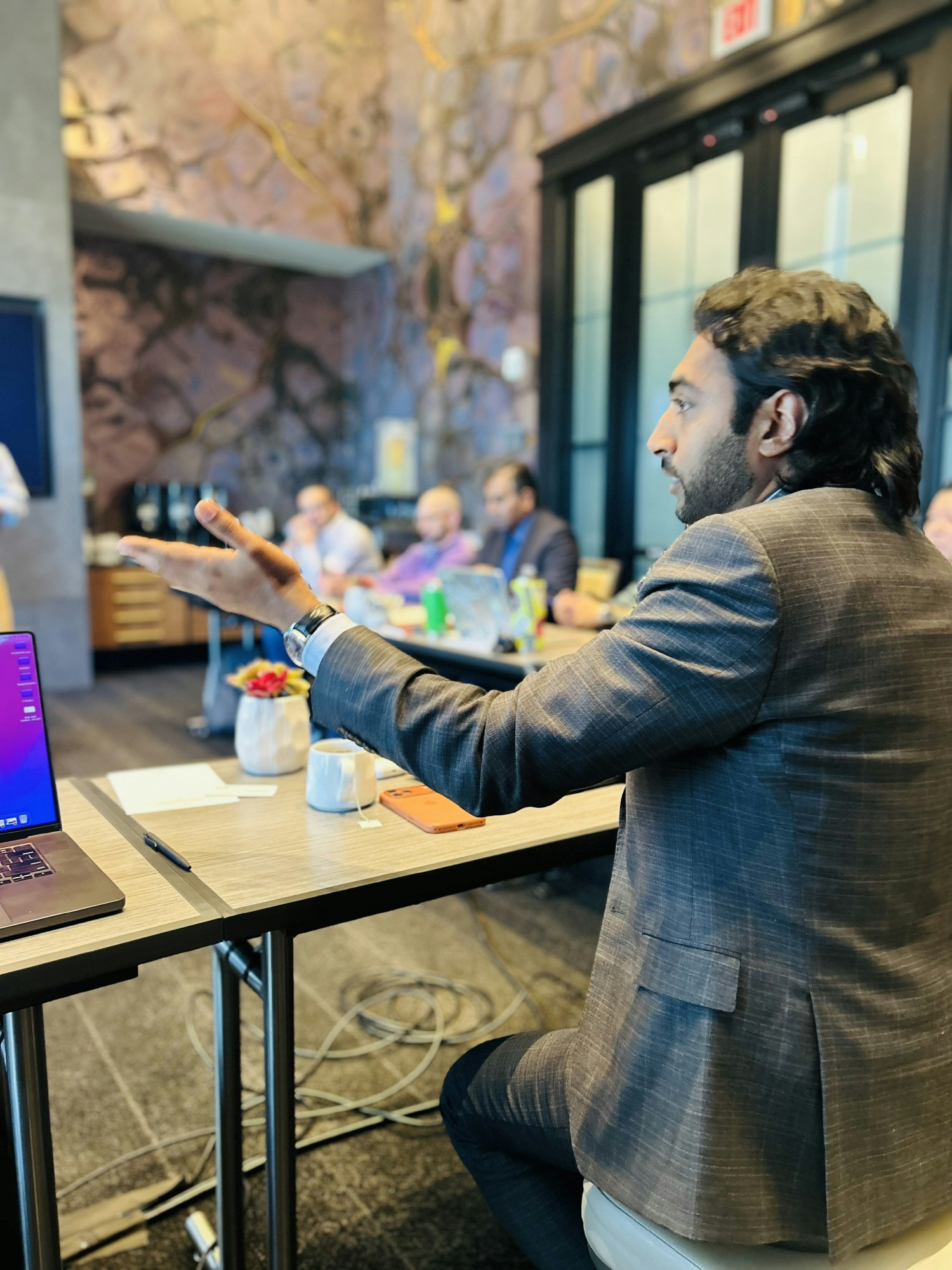 Praveen Singalla, CEO, leading the team energetically at the 2026 Executive Kickoff offsite meeting in Tysons Corner, VA