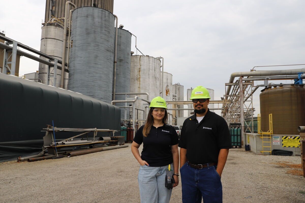 Two plant employees proudly standing outside one of our US facilities.