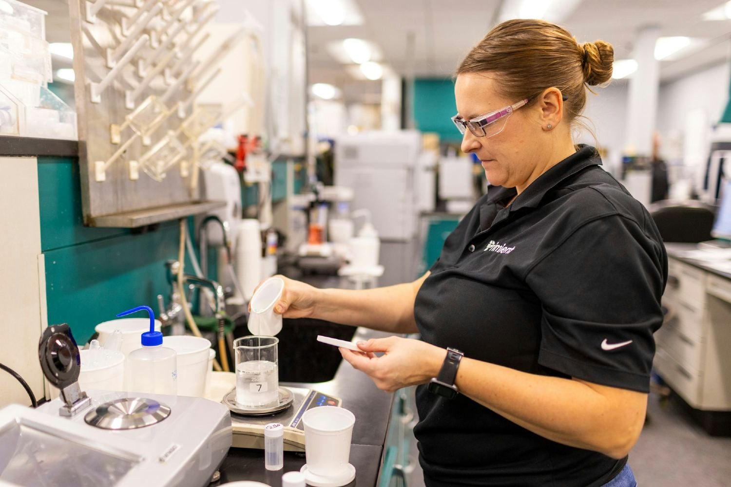 A snapshot of a laboratory technician at work, showcasing their innovative and sustainable solutions for our partners.