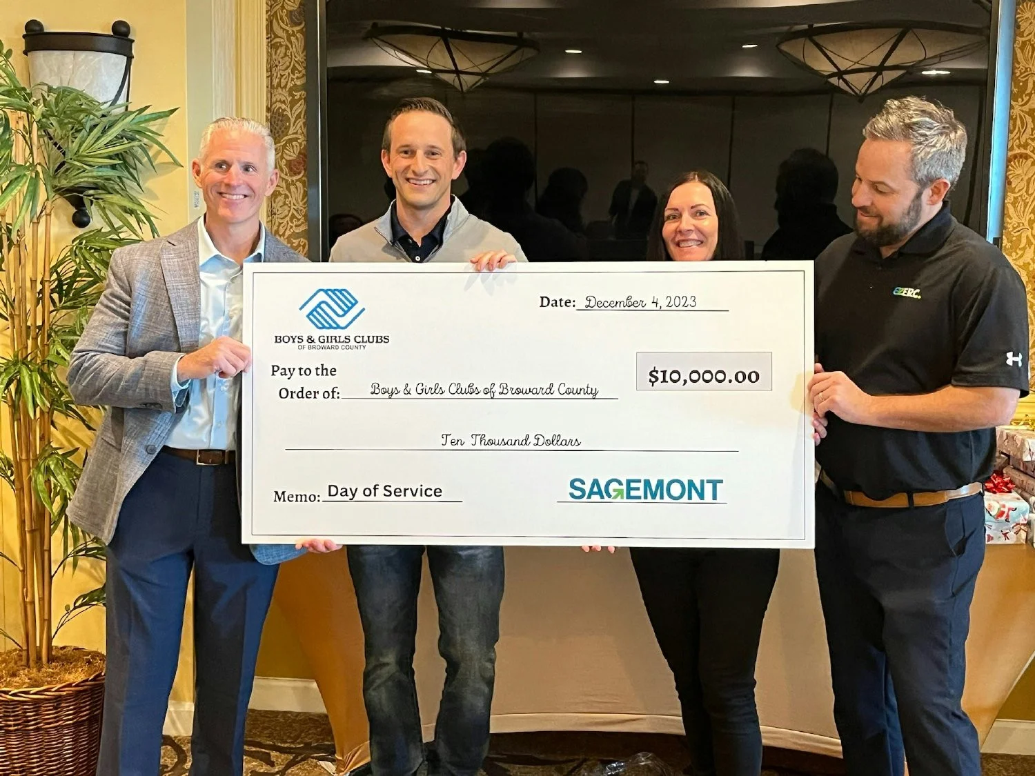 Presenting our donation check to the Boys & Girls Club of Broward County