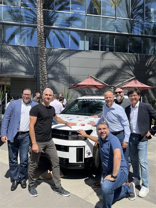 HCA Leaders participate in the Hyundai Hope On Wheels hand printing event at an HCA office.