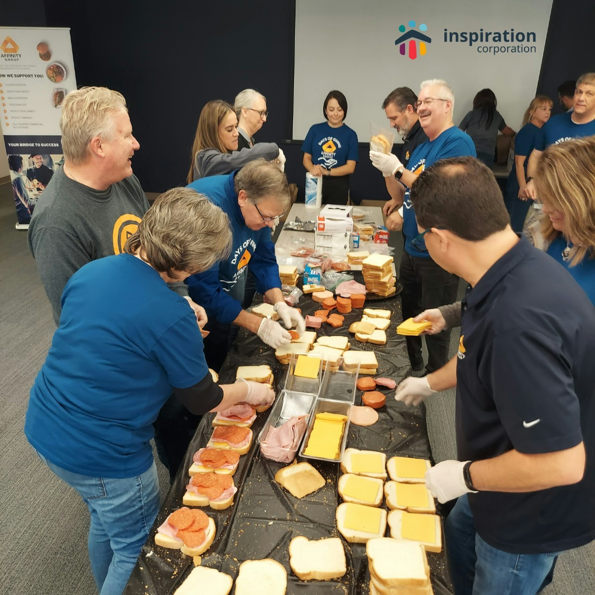 Midwest Team packing lunches to help feed their local community. 