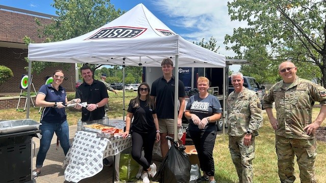 Planet volunteers with the USO, going out with the tailgate trailer to grill food for military personnel throughout DC. 
