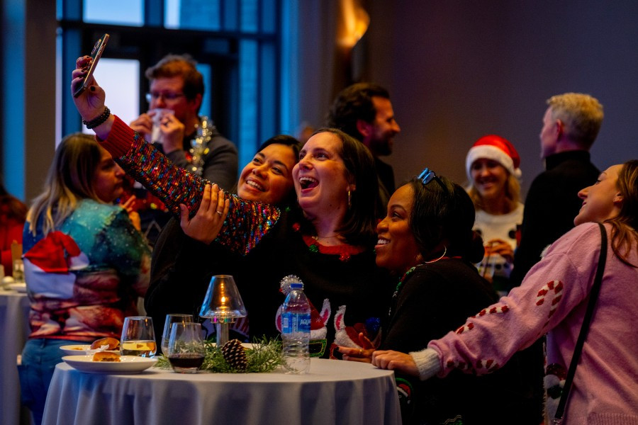 Employees celebrating a successful year at our Ugly Sweater holiday party in December 2024. 