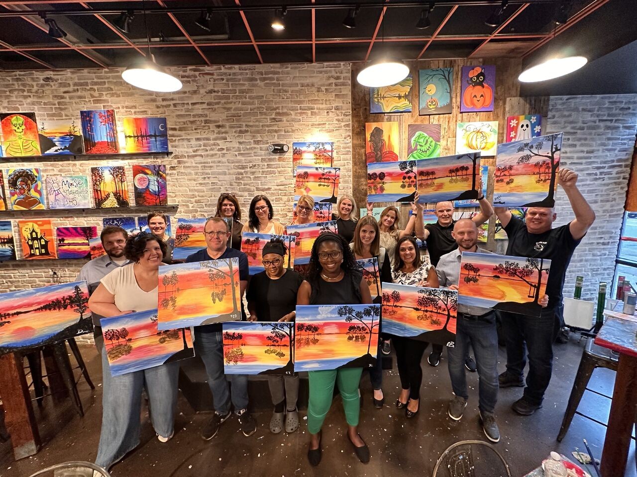 TI employees enjoying some fun at an offsite paint event! 