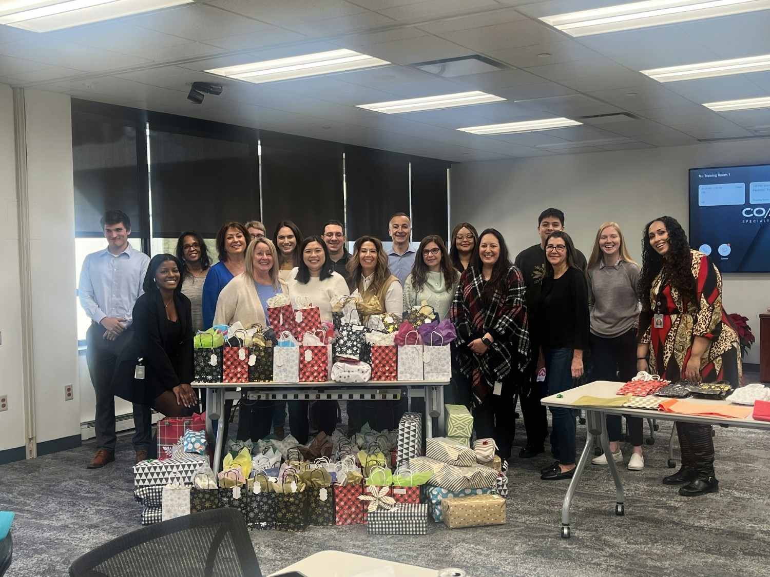 A gift-wrapping event during an Employee Resource Group sponsored drive for a nonprofit organization