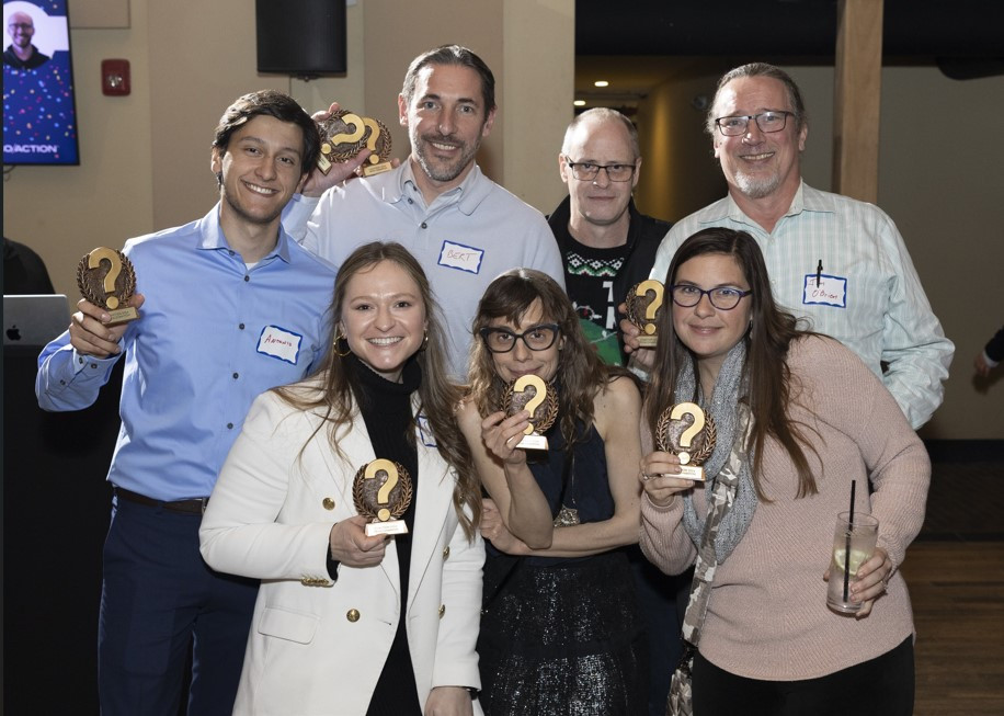 2024 Trivia winning team from our holiday party. 