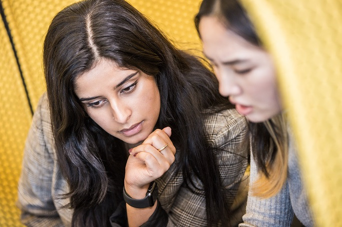 Employees using collaboration pods in the San Francisco office to have a quick connection. 