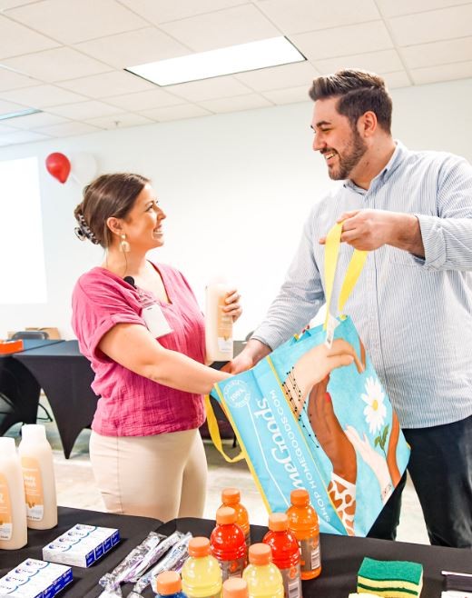 Navvis partners with the St. Louis Diaper Bank to assemble 16,000 diaper bundles for needy families. 