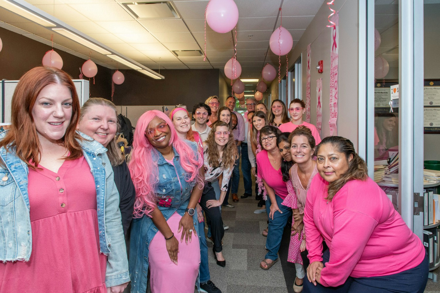 Team spirit on full display! ESi staff lined the hallways in vibrant pink to support Breast Cancer Awareness Month