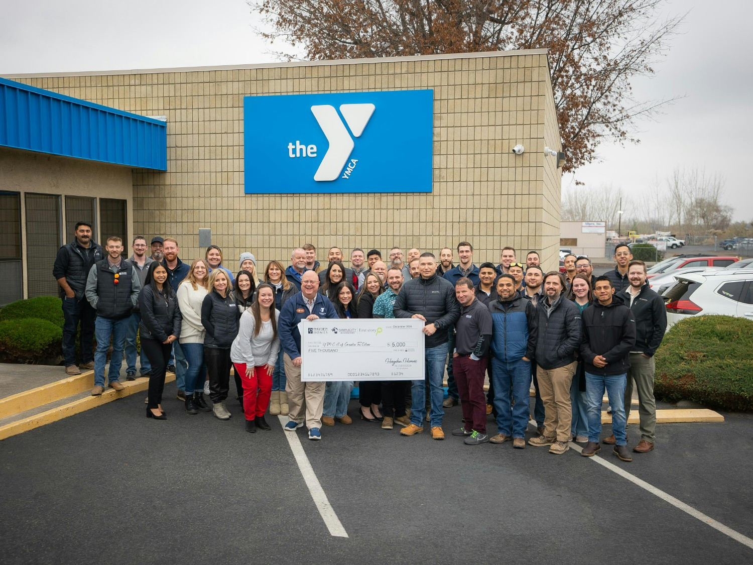 Washington team members delivering a First Story Grant check to The Boys and Girls Club of Greater Tri Cities.
