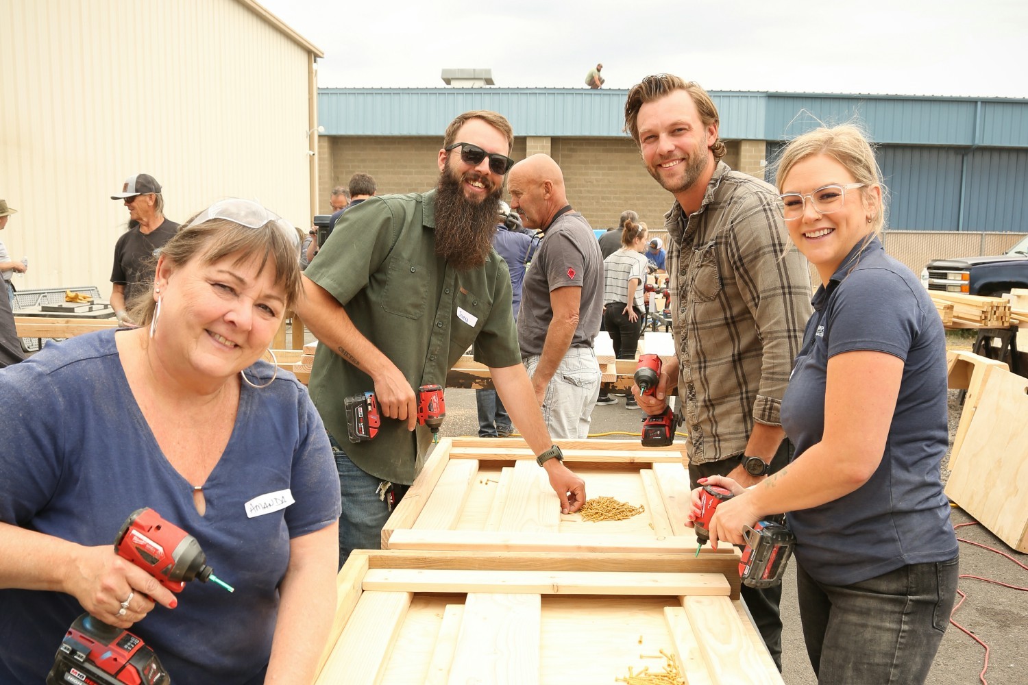 Hayden Homes team members building bunk beds for kids, that are delivered by nonprofit Sleep in Heavenly Peace.

