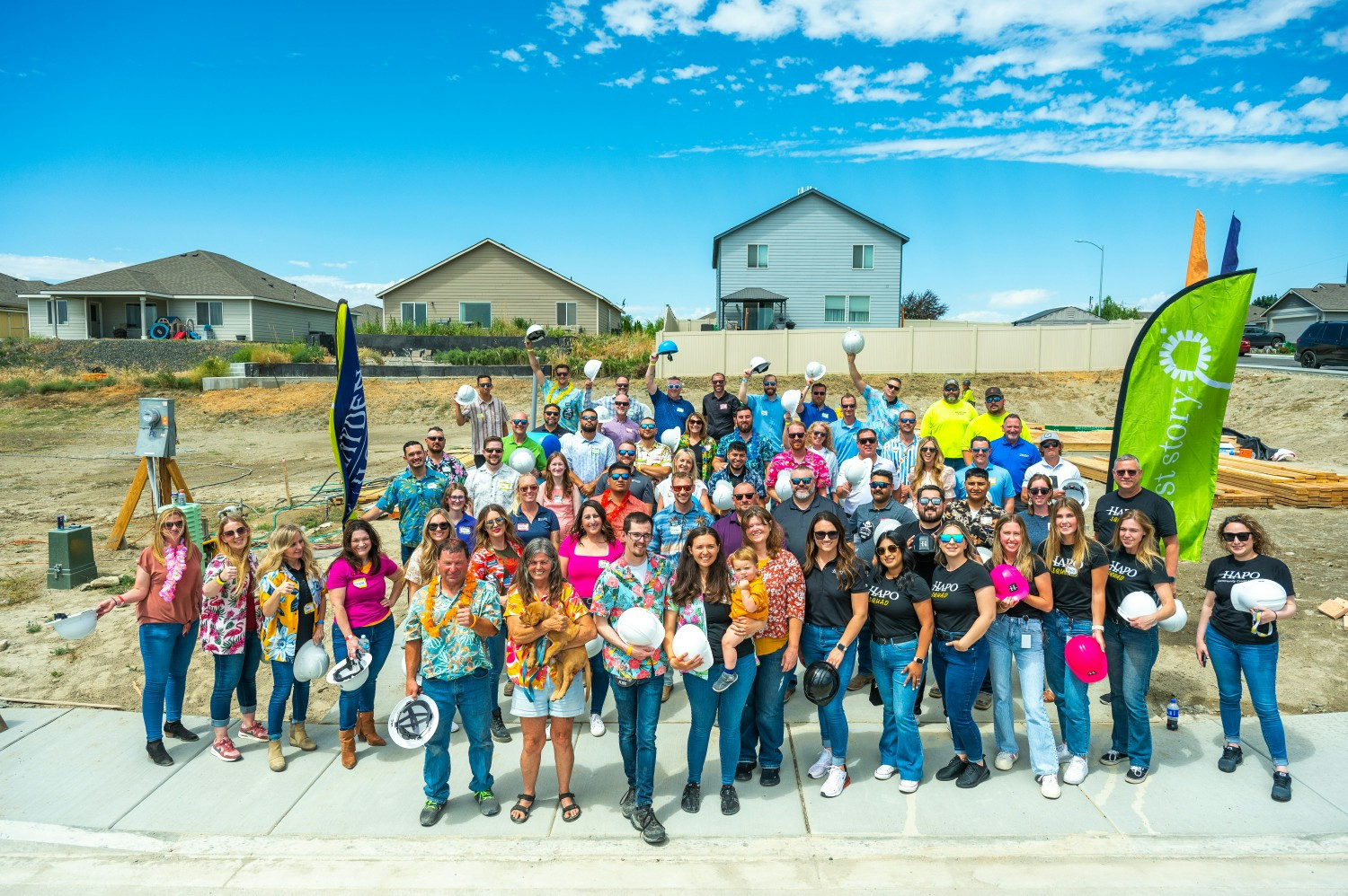 Team members at our First Story Team Build, where team members raised walls and celebrated a First Story family. 