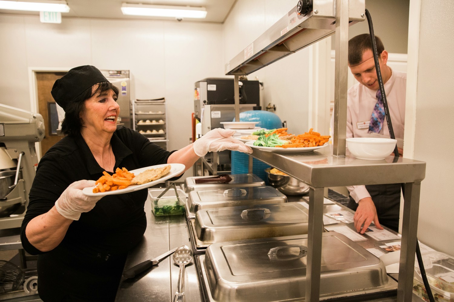 It is not uncommon for the management team to lend a helping hand in the dining room.