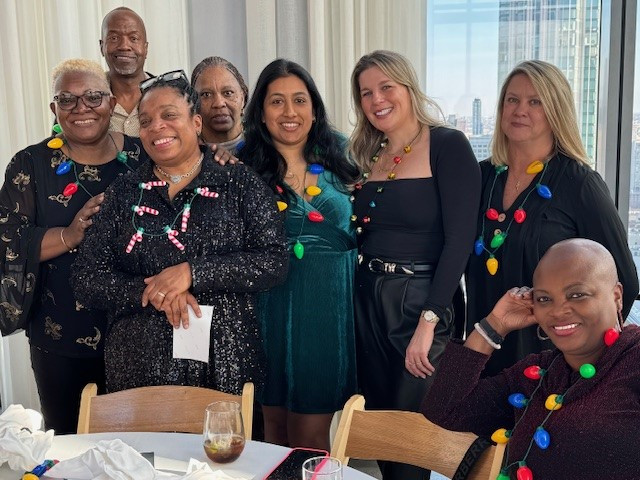 Employees celebrating at the annual Healthcare Risk Advisors Holiday dinner.