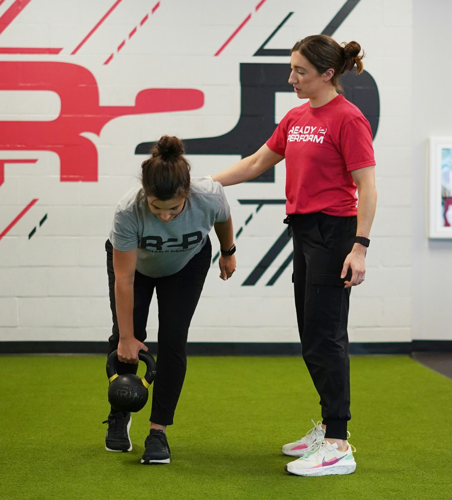 Dr. Madi working with a peripartum mother during one of her physical therapy sessions. 