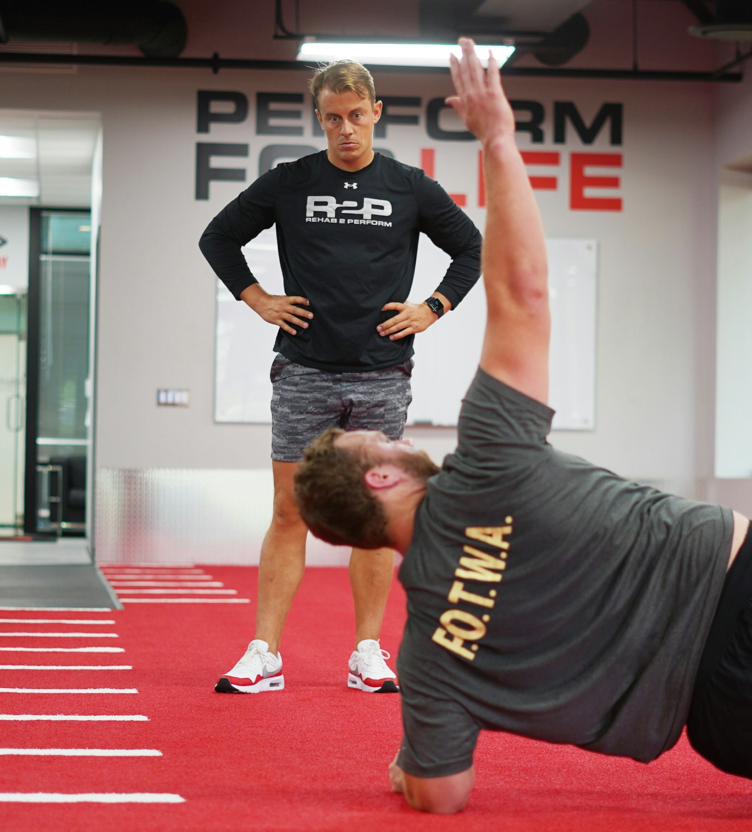 Dr. Josh observing an NFL player go through shoulder rehabilitation. 