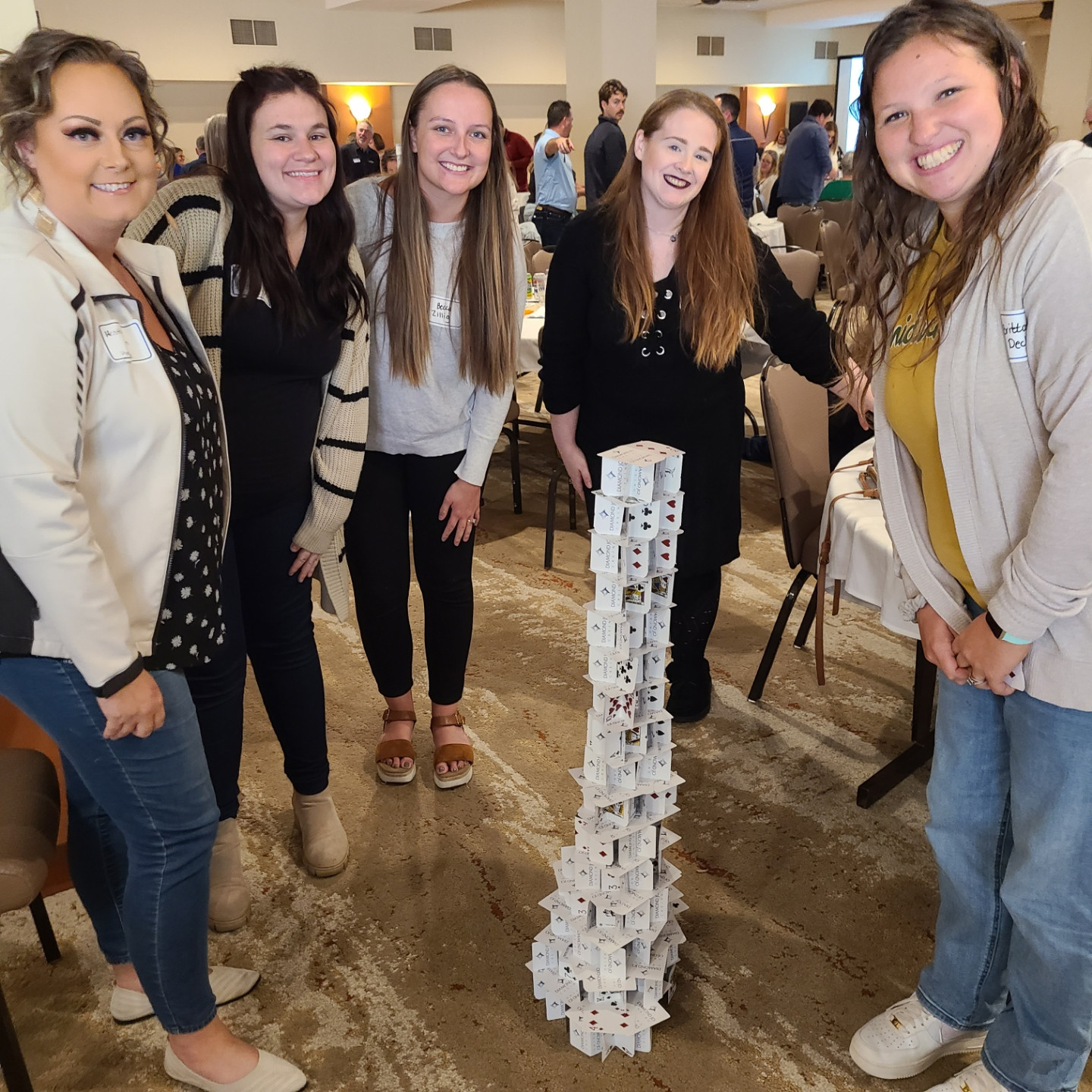 At our annual meeting our employees participated in a team building event to see who could build the tallest card tower!