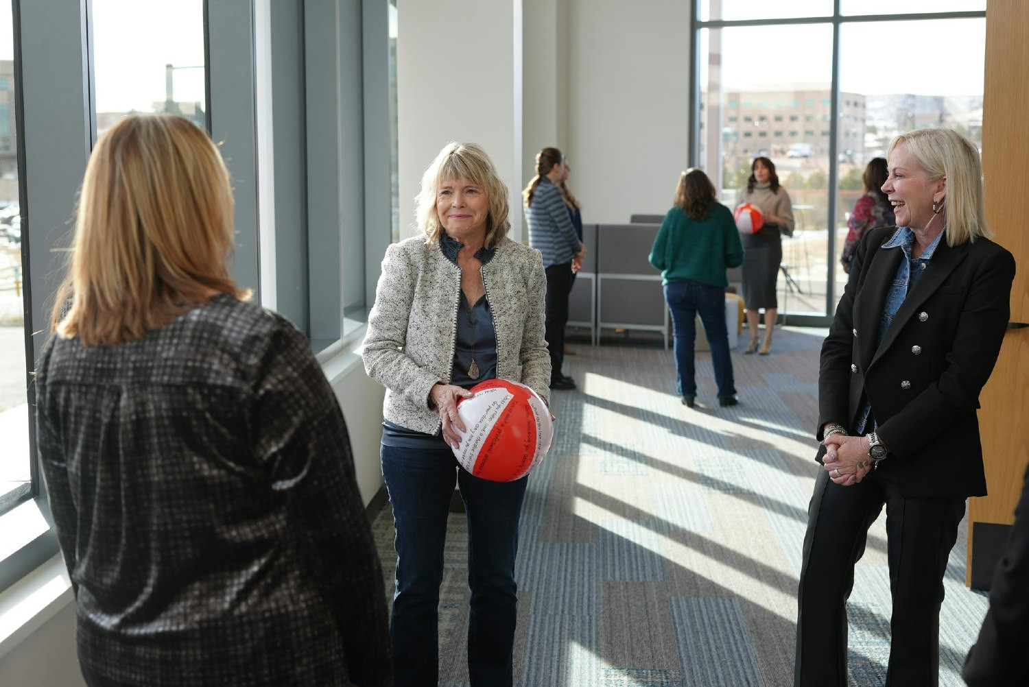 This photo was taken at our annual kick-off meeting where employees participated in a team building activity.