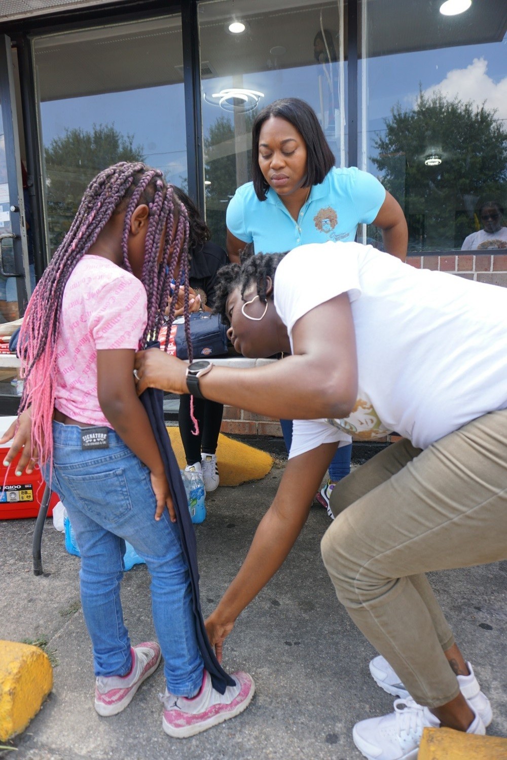 Issuing backpacks, uniforms, and supplies to children of our clients and other children in need in the community. 
