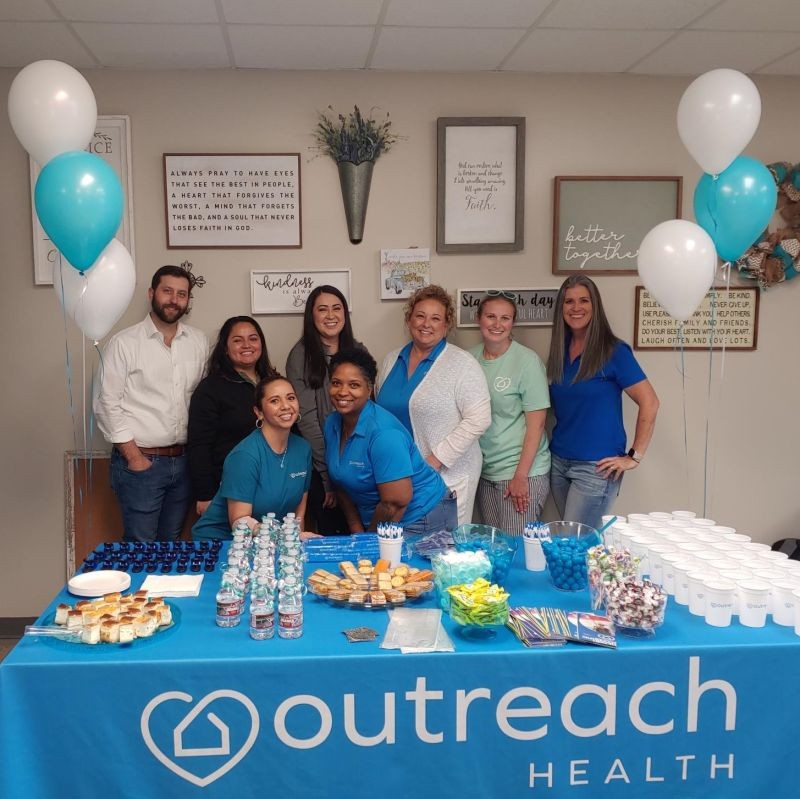 Team members celebrating Outreach open house