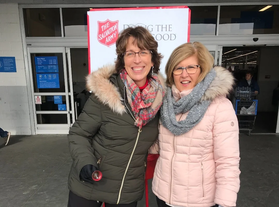 Employees volunteering to Ring the Bell for the Salvation Army. 