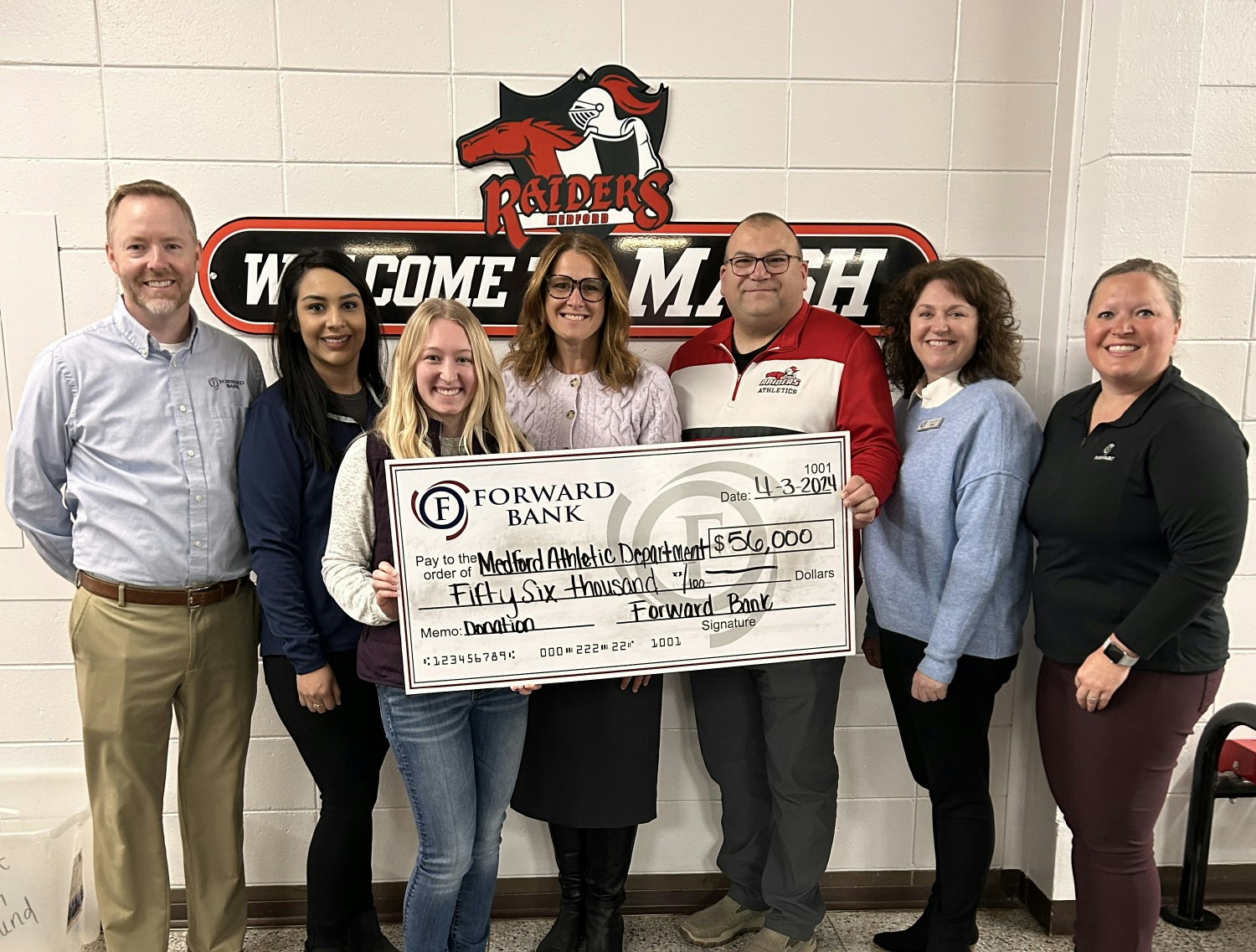 $56k Donation to Medford School for gym floor updates and scoreboard