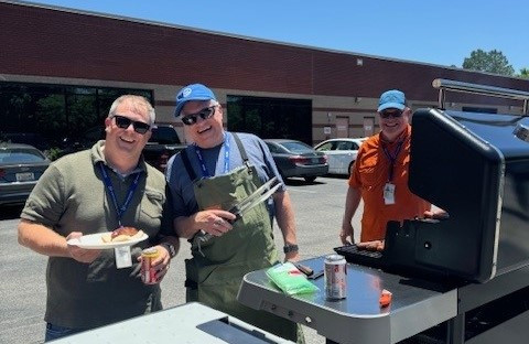 nSI executives cookout for our employees.