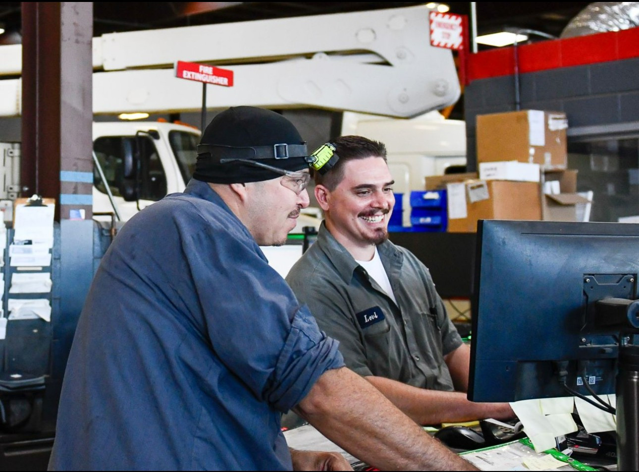 Teamwork in Action: Collaborating to achieve excellence, these two employees demonstrate the power of working together. 