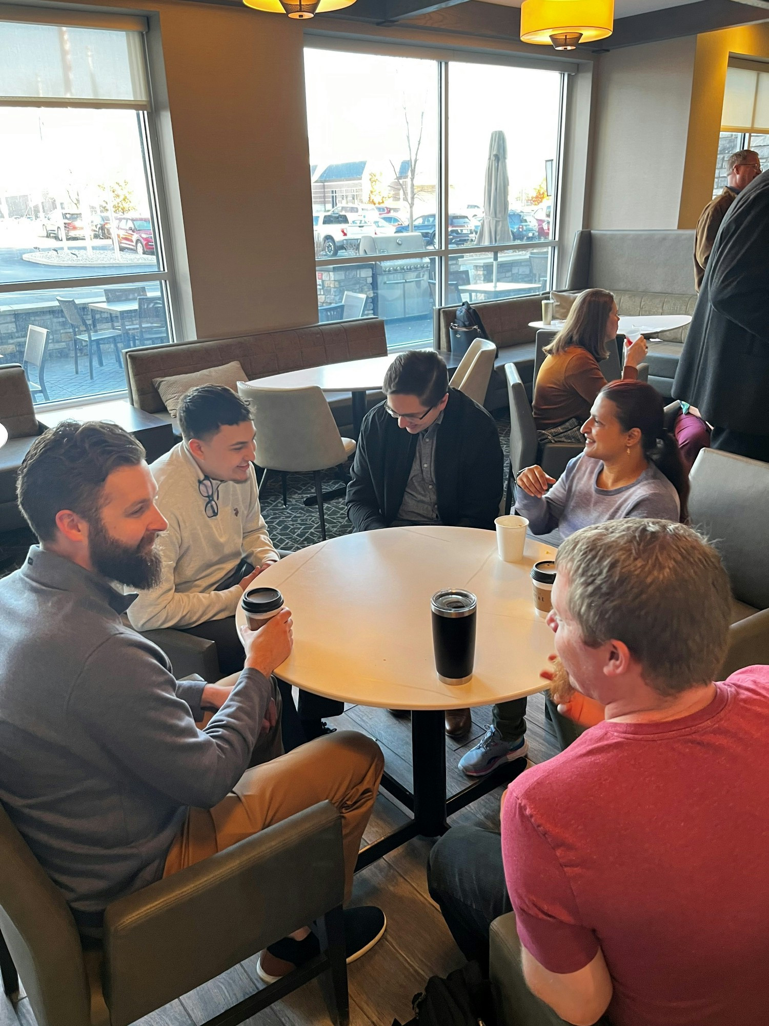 Chatting and connecting at the in-person event. 