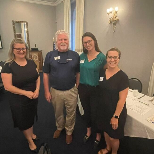 Employees giving a speech at the Louisiana Pipeliner dinner