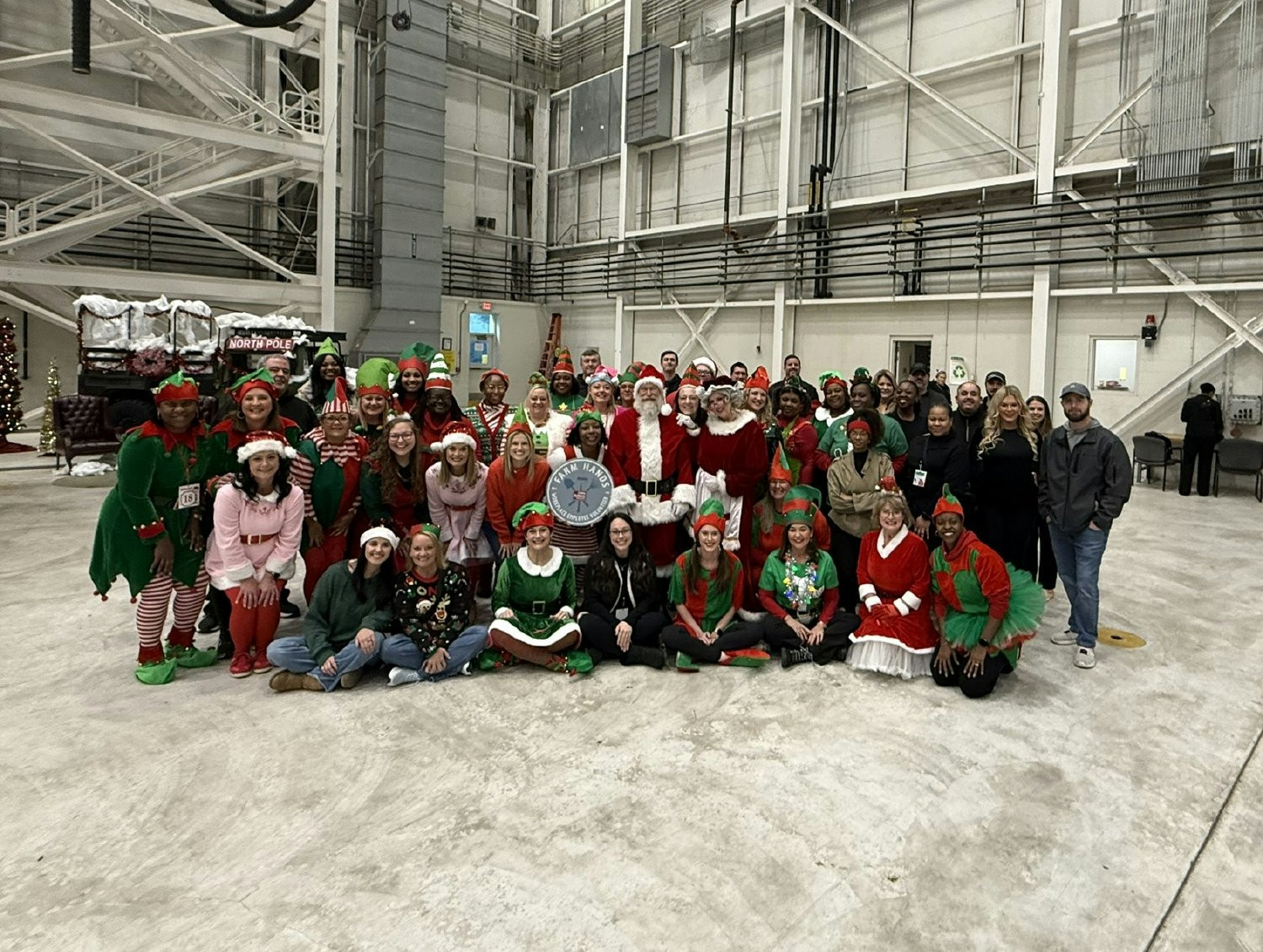 Employees volunteering for the Salvation Army's Flight to the North Pole event, giving back to strengthen our community.