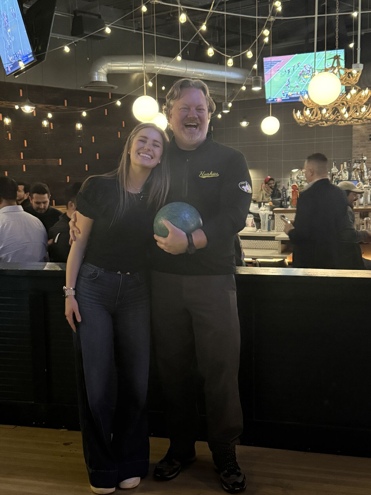 Our Senior Content Marketing Manager and head of Claims bowling at our offsite!