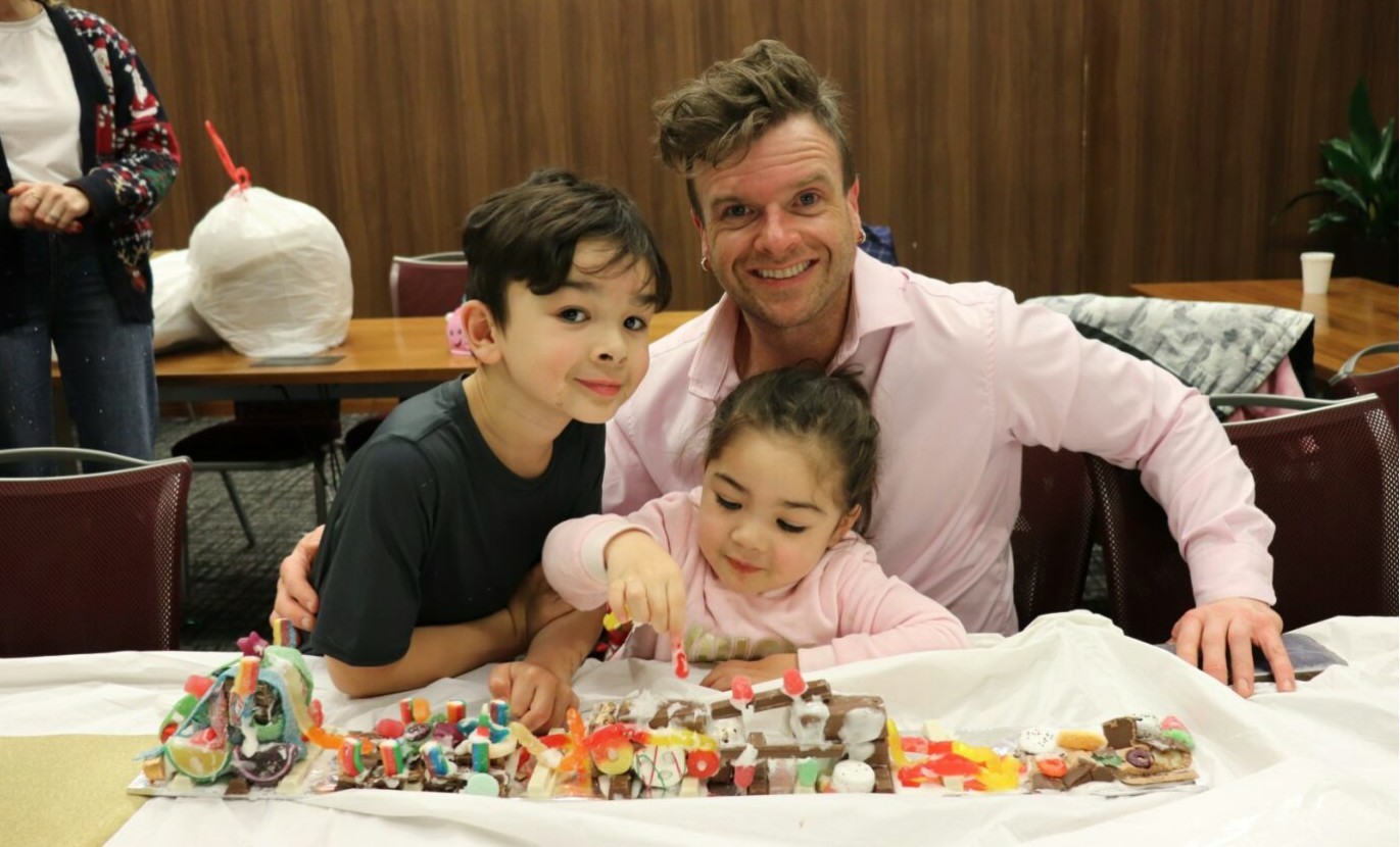 Principal Talent Advisor Reilly Whiting brings his children to enjoy our holiday candy train making celebration.