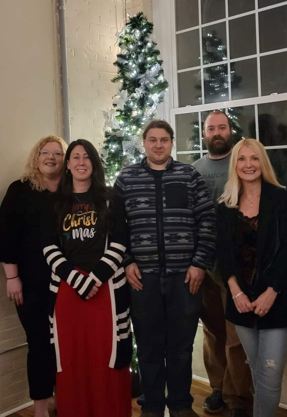 Party planning committee members celebrating the success of the holiday event.