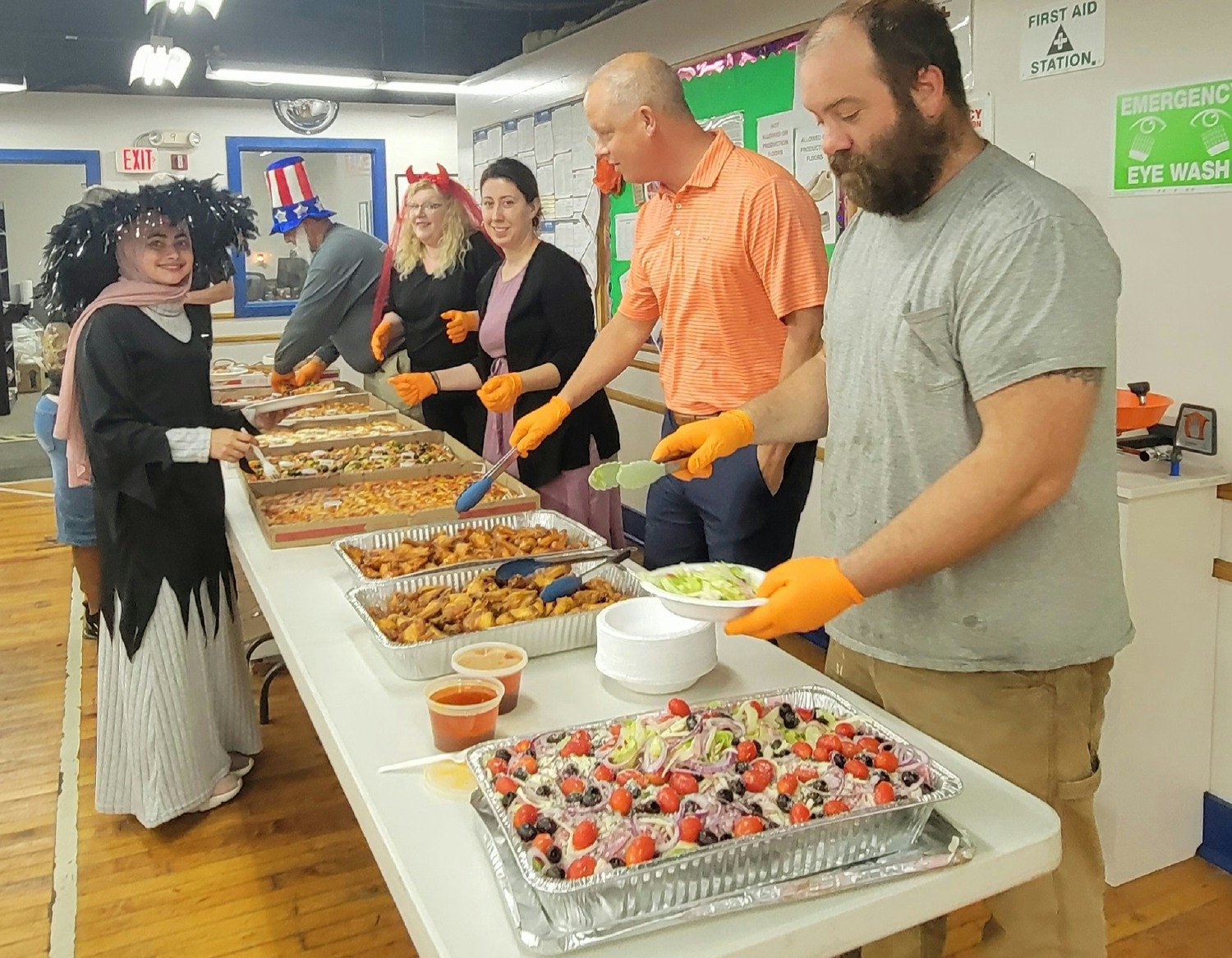 The President and team members serving a festive Halloween lunch.