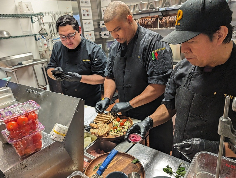 Some of our Culinary Team carefully crafting a delicious charcuterie board.