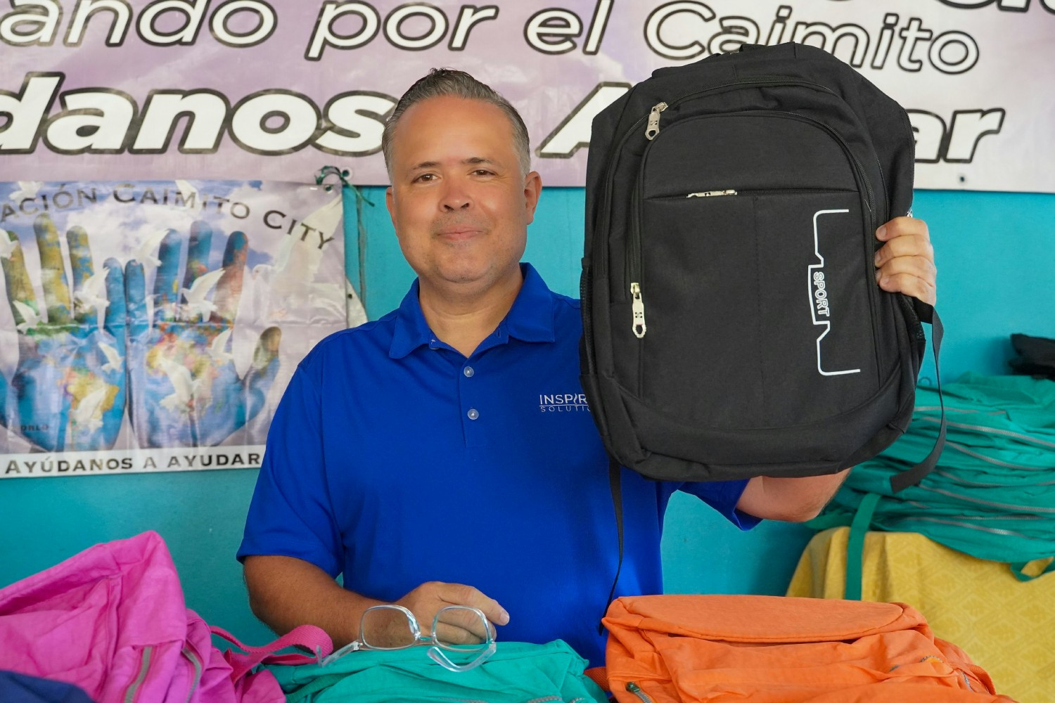 Inspired Solutions COO/CRO-Rick Pina Back Pack donation to a school in the Dominican Republic