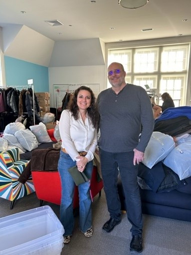 Dropping off a bundle of warmth of employee-donated coats heading out for the local charity's Annual Coat Drive.