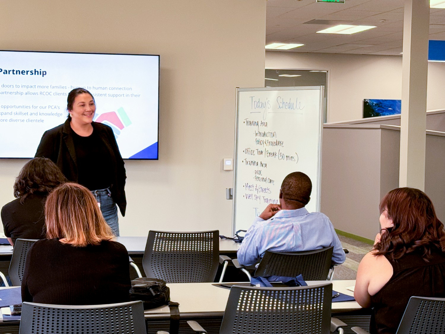 Our Executive Director, Monique Arredondo, meeting and welcoming our new personal care attendants at their orientation.
